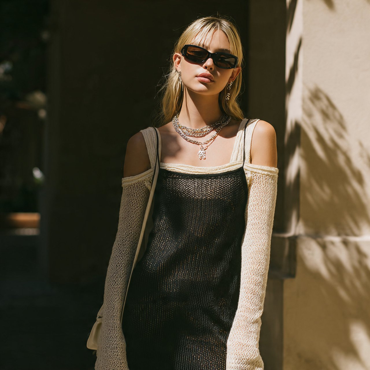 slip dress layered with lightweight knit