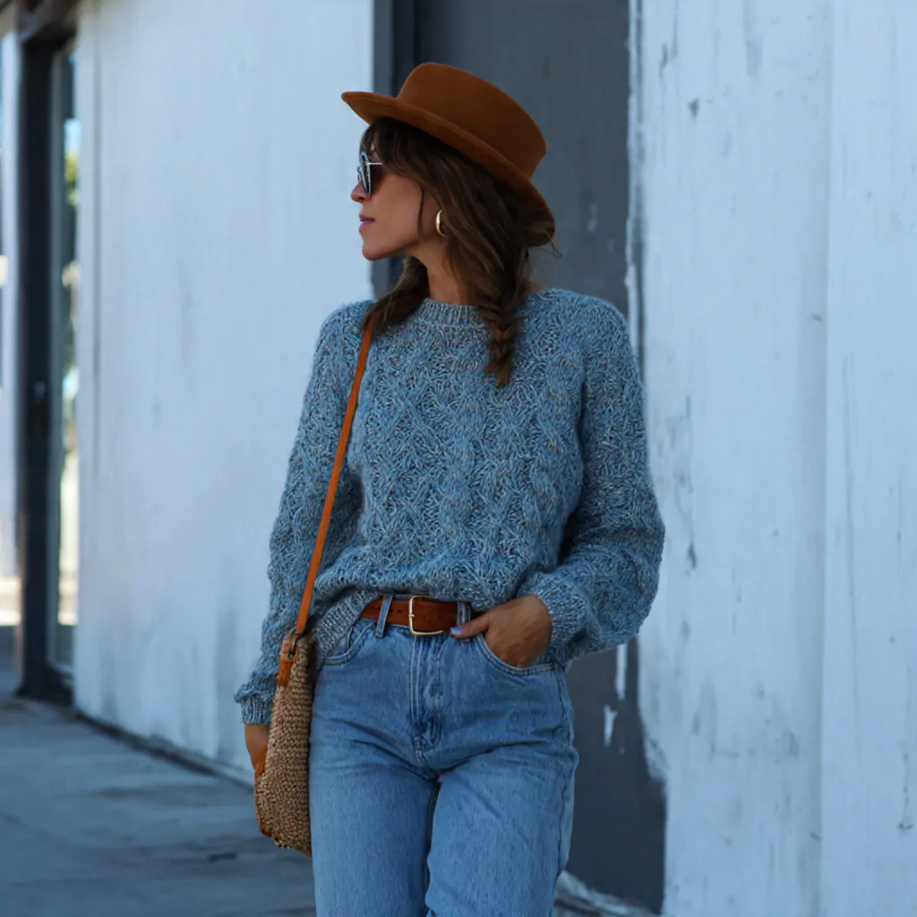 relaxed denim with knit sweater wearing a woman
