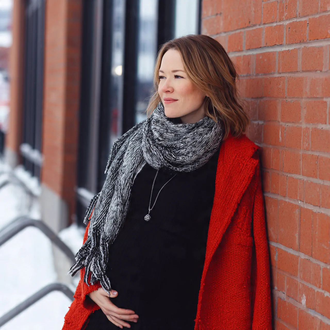 black base layers with statement coat and scarfpre