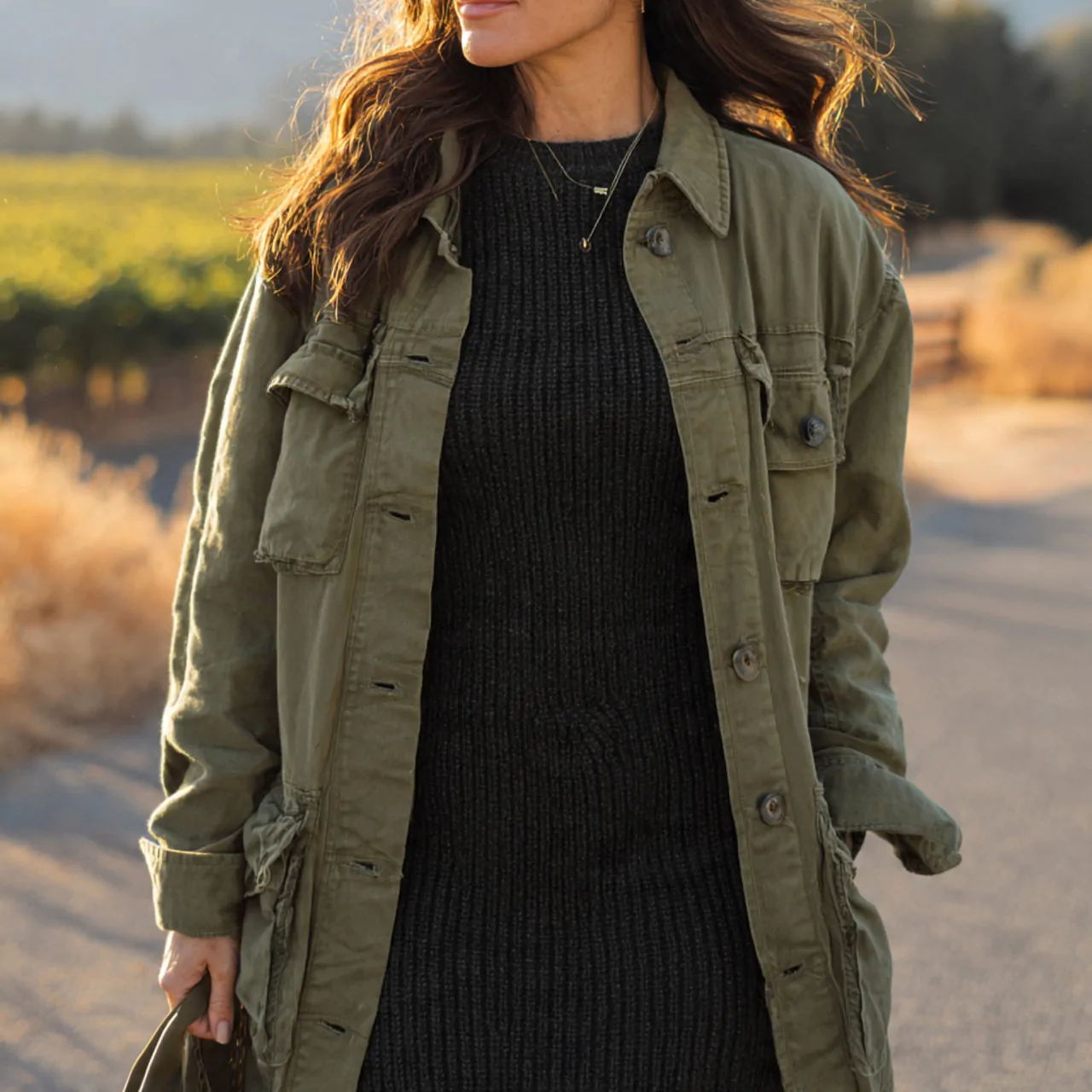 17 Thanksgiving Outfit Looks for Chic, Comfortable Holiday Style 5 olive utility jacket with black knit midi dresstha